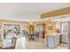 Bright dining area with sliding door to patio, adjacent to kitchen with light countertops at 750 Willow Ave, Henderson, NV 89002