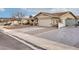 Single-story home with attached garage, driveway, and gated side yard at 750 Willow Ave, Henderson, NV 89002