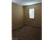 Simple carpeted bedroom with a window and neutral walls at 8708 Gateway Glen Dr, Las Vegas, NV 89178