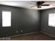 Spacious bedroom with two windows and neutral-colored walls at 8708 Gateway Glen Dr, Las Vegas, NV 89178