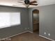 Primary bedroom with ceiling fan and neutral wall color at 8708 Gateway Glen Dr, Las Vegas, NV 89178