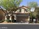 Two-story house with a landscaped yard and attached garage at 8708 Gateway Glen Dr, Las Vegas, NV 89178
