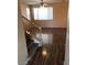 Living room with laminate wood flooring and access to staircase at 8708 Gateway Glen Dr, Las Vegas, NV 89178