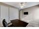 Bedroom featuring wood-look floors, ample closet space, and a desk at 8864 Sherborne Gate Ave, Las Vegas, NV 89148