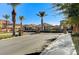 Gated community entrance with palm trees and stone pillars at 8864 Sherborne Gate Ave, Las Vegas, NV 89148