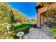 Landscaped backyard with lush greenery, a pool and spiral staircase at 8864 Sherborne Gate Ave, Las Vegas, NV 89148