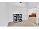 Bright bedroom with a built-in bookshelf, light walls and carpet at 9905 Barrier Reef Dr, Las Vegas, NV 89117