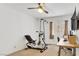 Bedroom features a ceiling fan, neutral walls and a window for natural light at 9905 Barrier Reef Dr, Las Vegas, NV 89117