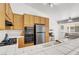 Kitchen showcasing stainless steel appliances and oak cabinetry at 9905 Barrier Reef Dr, Las Vegas, NV 89117