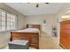 Cozy bedroom featuring a wooden bed frame and ample natural light at 1017 Chestnut Bay Ave, North Las Vegas, NV 89031