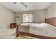 Serene bedroom featuring a comfortable wooden bed frame and window at 1017 Chestnut Bay Ave, North Las Vegas, NV 89031