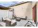 Outdoor patio with wicker furniture and shade umbrella at 1017 Chestnut Bay Ave, North Las Vegas, NV 89031