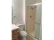 Bathroom with shower, toilet and wood vanity at 10321 Junction Hill Dr, Las Vegas, NV 89134