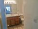 Clean bathroom, light wood vanity, toilet and shower at 10321 Junction Hill Dr, Las Vegas, NV 89134