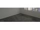 Simple bedroom with grey carpet and window with shutters at 10321 Junction Hill Dr, Las Vegas, NV 89134