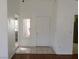 Entryway with tiled flooring, white walls, and a view to the living room at 10321 Junction Hill Dr, Las Vegas, NV 89134