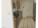 Light wood cabinets, stainless steel appliances, and tile flooring at 10321 Junction Hill Dr, Las Vegas, NV 89134