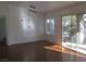 Living room with hardwood floors and sliding glass doors to patio at 10321 Junction Hill Dr, Las Vegas, NV 89134