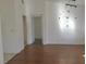 Living room with hardwood floors and access to other rooms at 10321 Junction Hill Dr, Las Vegas, NV 89134