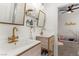 Elegant bathroom with dual sinks, gold fixtures, and stylish shelving at 10729 Grey Havens Ct, Las Vegas, NV 89135