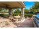 Covered patio with tables and chairs, ideal for outdoor gatherings at 10809 Garden Mist Dr # 1019, Las Vegas, NV 89135