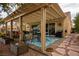 Relaxing backyard patio with pergola, seating, and plants at 11008 Hawk Valley Ave, Las Vegas, NV 89134