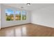 Bright bedroom with wood floors and large windows at 1197 Orchard View St, Las Vegas, NV 89142