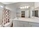 Bathroom with a large vanity, toilet, and shower-tub combination at 1595 Cattle Ranch Pl, Henderson, NV 89002