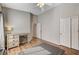 Bedroom with a gray area rug, desk, chair, and ample natural light at 1595 Cattle Ranch Pl, Henderson, NV 89002