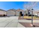 Charming single-story home featuring a well-manicured lawn, desert landscaping and a three car garage at 1595 Cattle Ranch Pl, Henderson, NV 89002