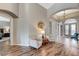 Bright entry area leading to a bedroom, living spaces, and elegant tile flooring at 1595 Cattle Ranch Pl, Henderson, NV 89002