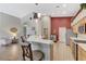 Open kitchen with a breakfast bar, stainless steel appliances, and modern countertops at 1595 Cattle Ranch Pl, Henderson, NV 89002