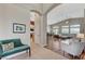 Open-concept living area with high ceilings, tile flooring and seamless access to the kitchen at 1595 Cattle Ranch Pl, Henderson, NV 89002