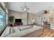 Open-concept living area with high ceilings, wood flooring and seamless access to the foyer at 1595 Cattle Ranch Pl, Henderson, NV 89002