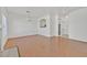 Spacious living room offering wood floors, white walls, fireplace, dining area, and natural light at 1900 N Torrey Pines Dr # 112, Las Vegas, NV 89108