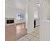 View of the living room, featuring fireplace, tile entry, and connection to the kitchen at 1900 N Torrey Pines Dr # 112, Las Vegas, NV 89108