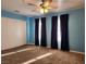 Blue bedroom with ample closet space and window coverings at 2060 Mesquite Ln # 104, Laughlin, NV 89029