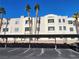 Two-story building with covered parking and desert landscaping at 2060 Mesquite Ln # 104, Laughlin, NV 89029