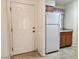 Condo entryway with white door and kitchen view at 2060 Mesquite Ln # 104, Laughlin, NV 89029