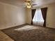 Bright living room with large window and ceiling fan at 2060 Mesquite Ln # 104, Laughlin, NV 89029