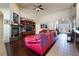 Bright living room with a red sectional sofa, fireplace, and built-in shelving at 2061 Iroquois Ave, Pahrump, NV 89048