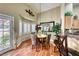 Charming dining area with wood floors and a round table at 209 Long Shadow Ter, Henderson, NV 89015