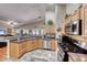 Modern kitchen with stainless steel appliances and granite countertops at 209 Long Shadow Ter, Henderson, NV 89015