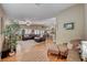 Living area with hardwood floors, comfortable seating and large windows at 209 Long Shadow Ter, Henderson, NV 89015