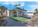 Relaxing backyard oasis with a swimming pool and covered patio at 2116 Fuller Rd, Las Vegas, NV 89108