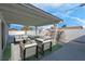 Covered patio, pool, and rock waterfall feature at 2116 Fuller Rd, Las Vegas, NV 89108