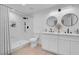 Clean bathroom with marble shower, double vanity, and contemporary fixtures at 2116 Fuller Rd, Las Vegas, NV 89108