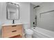 Clean bathroom with modern vanity, bathtub, and gray tile at 2116 Fuller Rd, Las Vegas, NV 89108