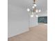 Bright dining room with modern chandelier and hardwood floors at 2116 Fuller Rd, Las Vegas, NV 89108