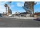 Ranch style home with a well-manicured lawn and mature trees at 2116 Fuller Rd, Las Vegas, NV 89108